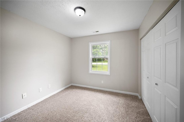 3031 Logan Ln Unit 1, Rock Creek, OH 44084 - unfurnished bedroom featuring carpet floors and a closet