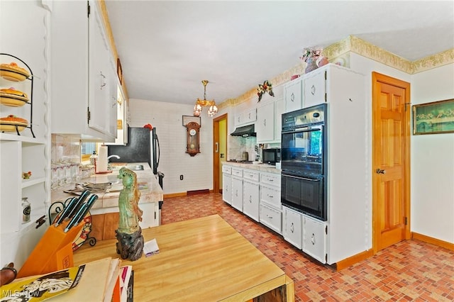 3612 Ridge Rd, Cortland, OH 44410 - kitchen featuring black appliances, under cabinet range hood, brick patterned flooring, white cabinetry, and light countertops