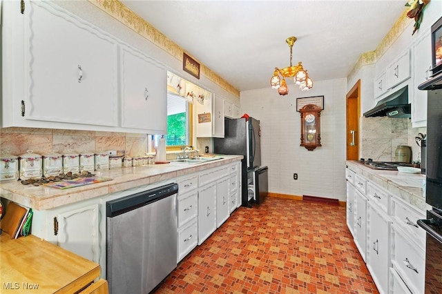 3612 Ridge Rd, Cortland, OH 44410 - kitchen with appliances with stainless steel finishes, under cabinet range hood, white cabinets, and light countertops