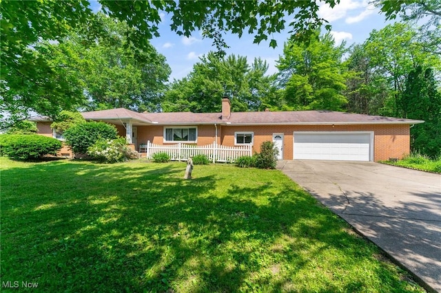 3612 Ridge Rd, Cortland, OH 44410 - ranch-style house with brick siding, an attached garage, driveway, and a chimney