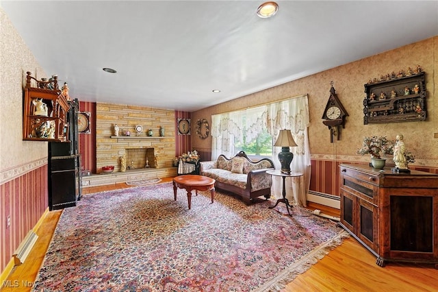 3612 Ridge Rd, Cortland, OH 44410 - living room with wallpapered walls, wainscoting, light wood finished floors, a fireplace, and recessed lighting
