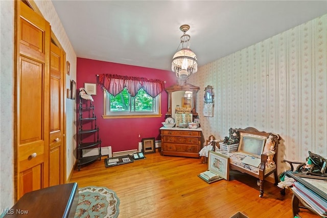 3612 Ridge Rd, Cortland, OH 44410 - sitting room with light wood finished floors, a chandelier, and a baseboard radiator