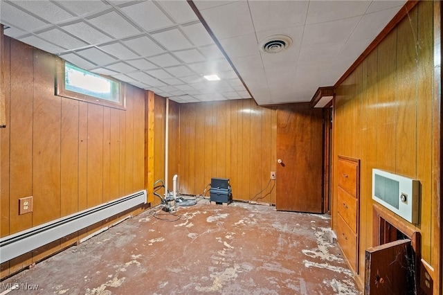3612 Ridge Rd, Cortland, OH 44410 - below grade area featuring wood walls and a baseboard heating unit