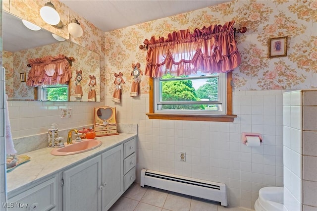 3612 Ridge Rd, Cortland, OH 44410 - bathroom with a baseboard radiator, tile walls, wallpapered walls, healthy amount of natural light, and vanity