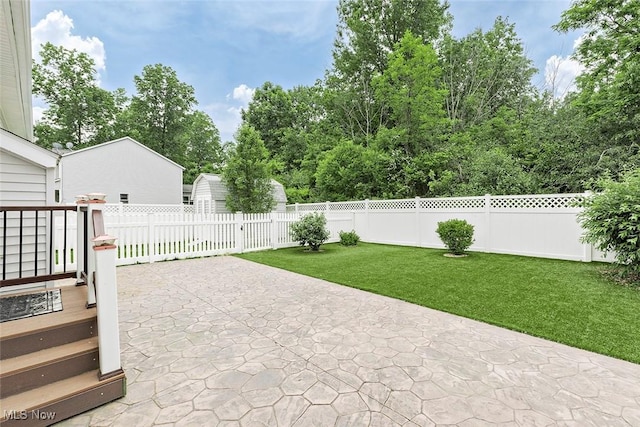 686 Outrigger Cv, Painesville, OH 44077 - fenced backyard featuring a patio area