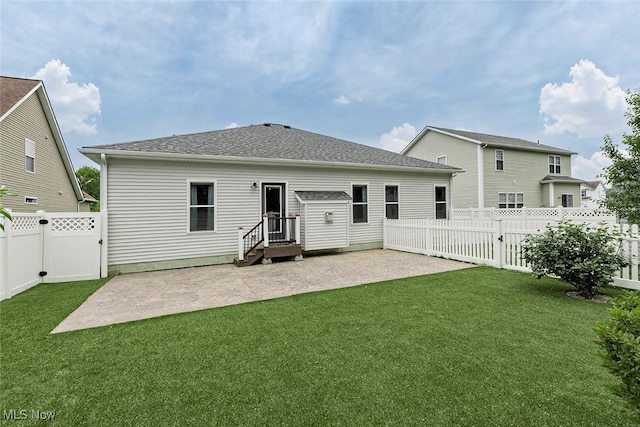 686 Outrigger Cv, Painesville, OH 44077 - rear view of house featuring a patio area, a fenced backyard, and roof with shingles