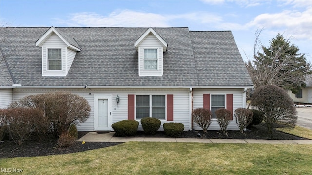 662 2nd St Unit 2, Fairport Harbor, OH 44077 - cape cod house with a front lawn and a shingled roof