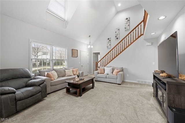 662 2nd St Unit 2, Fairport Harbor, OH 44077 - carpeted living room with stairway, high vaulted ceiling, and recessed lighting