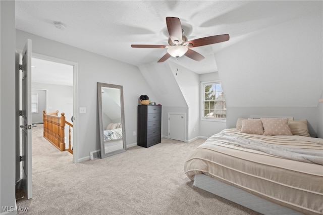 662 2nd St Unit 2, Fairport Harbor, OH 44077 - carpeted bedroom with vaulted ceiling and a ceiling fan