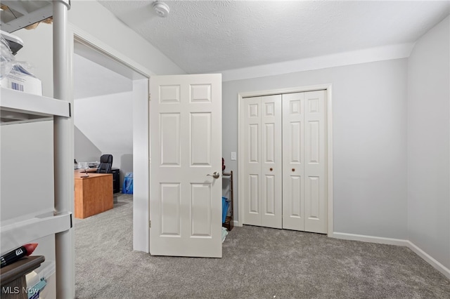662 2nd St Unit 2, Fairport Harbor, OH 44077 - unfurnished bedroom featuring carpet floors, a desk, and a closet