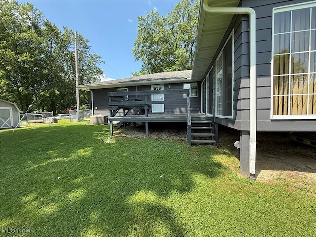 3726 Silvieus St, Ashtabula, OH 44004 - rear view of house featuring a deck and a yard