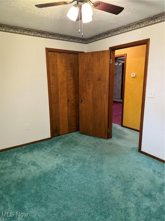 3726 Silvieus St, Ashtabula, OH 44004 - unfurnished bedroom with carpet flooring, a closet, and a ceiling fan