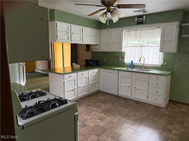 3726 Silvieus St, Ashtabula, OH 44004 - kitchen with white appliances, a ceiling fan, a peninsula, and white cabinetry