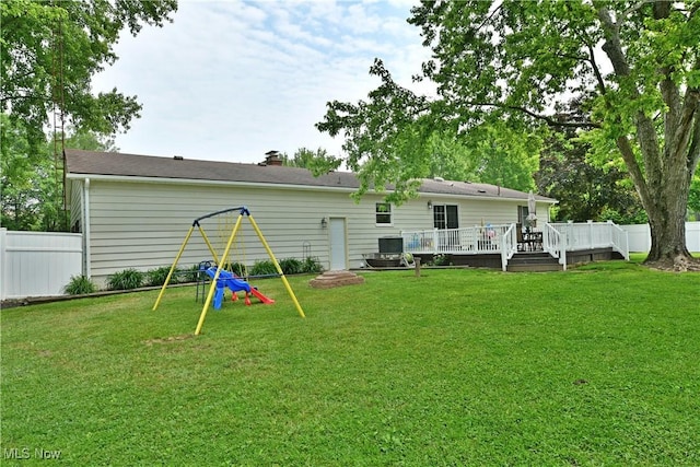 2847 Selkirk Bush Rd SW, Warren, OH 44481 - back of property with a wooden deck, a fenced backyard, and a chimney