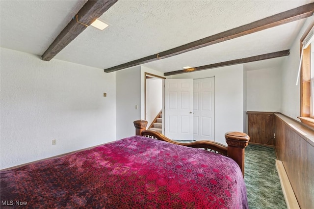 3917 Oxford Dr, Lorain, OH 44053 - bedroom with beam ceiling, carpet floors, and a textured ceiling