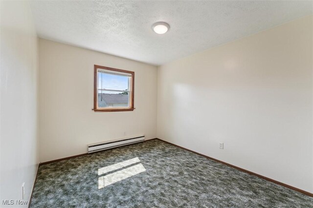 3917 Oxford Dr, Lorain, OH 44053 - carpeted empty room featuring baseboard heating and a textured ceiling