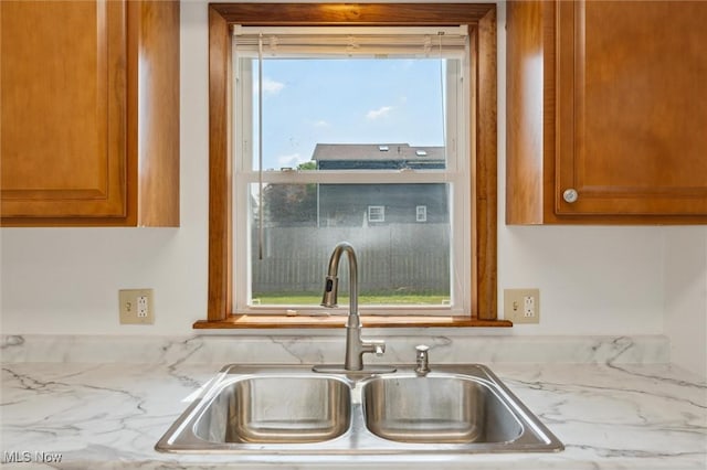3917 Oxford Dr, Lorain, OH 44053 - kitchen featuring brown cabinets and light stone countertops