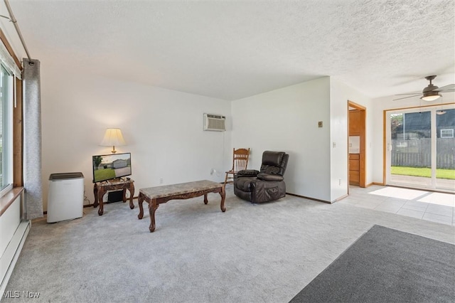 3917 Oxford Dr, Lorain, OH 44053 - sitting room with a baseboard heating unit, carpet flooring, ceiling fan, a wall mounted AC, and a textured ceiling