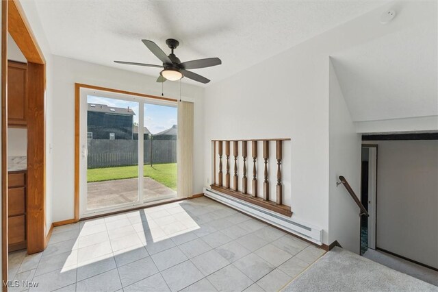 3917 Oxford Dr, Lorain, OH 44053 - spare room with baseboard heating, a ceiling fan, light tile patterned floors, and a smoke detector