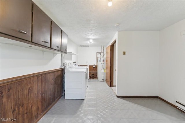 3917 Oxford Dr, Lorain, OH 44053 - laundry area with electric water heater, washer and clothes dryer, a textured ceiling, and cabinet space