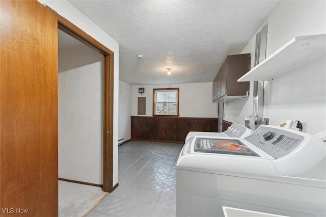 3917 Oxford Dr, Lorain, OH 44053 - laundry room featuring washer and dryer, a textured ceiling, and a baseboard heating unit