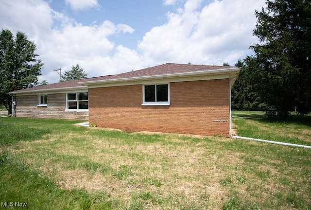 4029 Minard Rd NW, Dover, OH 44622 - view of side of property featuring a yard and brick siding