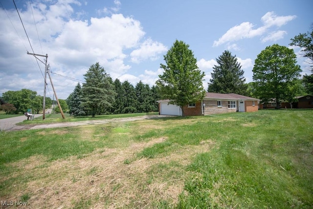 4029 Minard Rd NW, Dover, OH 44622 - view of grassy yard featuring an attached garage
