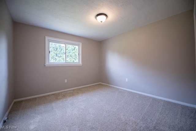 4029 Minard Rd NW, Dover, OH 44622 - unfurnished room featuring carpet flooring and a textured ceiling