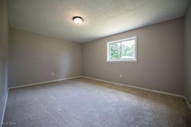 4029 Minard Rd NW, Dover, OH 44622 - empty room with carpet flooring and a textured ceiling