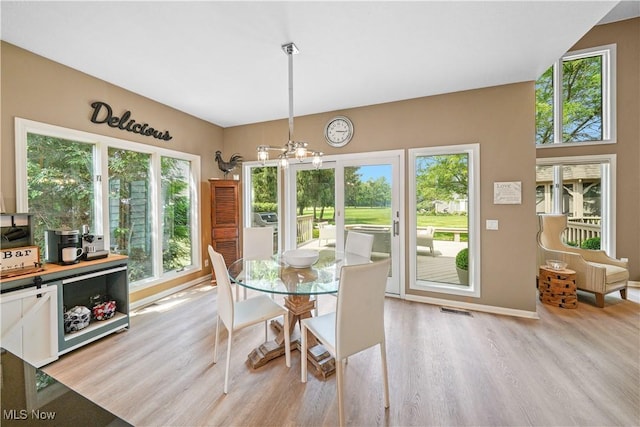 196 Chisholm Ct, Aurora, OH 44202 - dining room with light wood-style floors and a chandelier