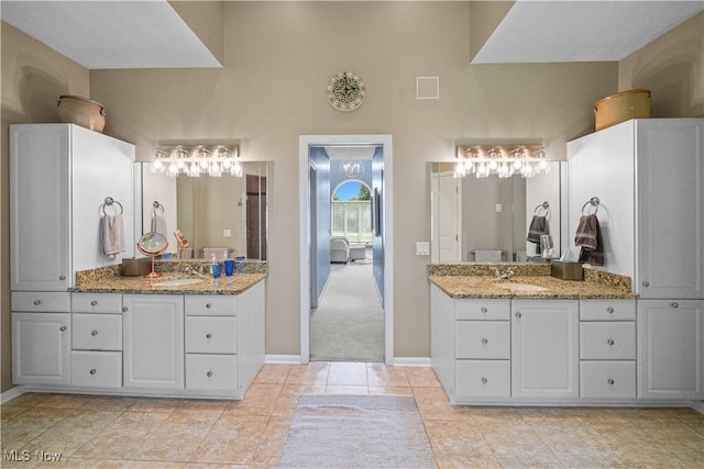 196 Chisholm Ct, Aurora, OH 44202 - full bath with two vanities and tile patterned floors
