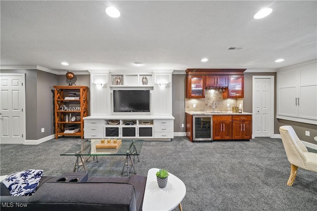 196 Chisholm Ct, Aurora, OH 44202 - carpeted living area featuring wine cooler, bar with sink, recessed lighting, and ornamental molding
