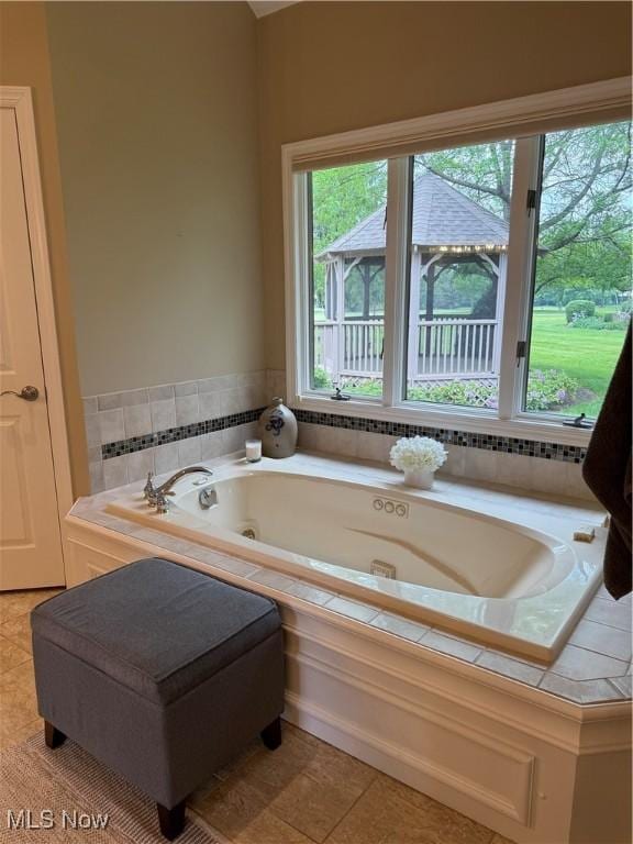 196 Chisholm Ct, Aurora, OH 44202 - full bathroom with a whirlpool tub and tile patterned flooring