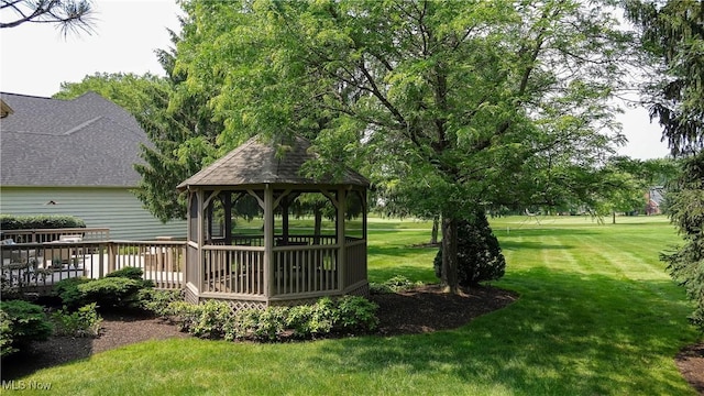 196 Chisholm Ct, Aurora, OH 44202 - view of grassy yard with a gazebo and a deck