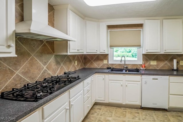 525 Marquardt Ave NE, North Canton, OH 44720 - kitchen with wall chimney exhaust hood, dishwasher, black gas cooktop, white cabinetry, and dark countertops