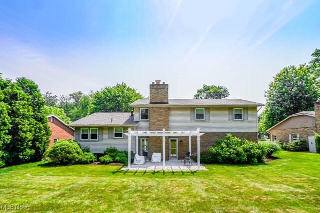 525 Marquardt Ave NE, North Canton, OH 44720 - back of house featuring a pergola, a patio, a lawn, a chimney, and brick siding