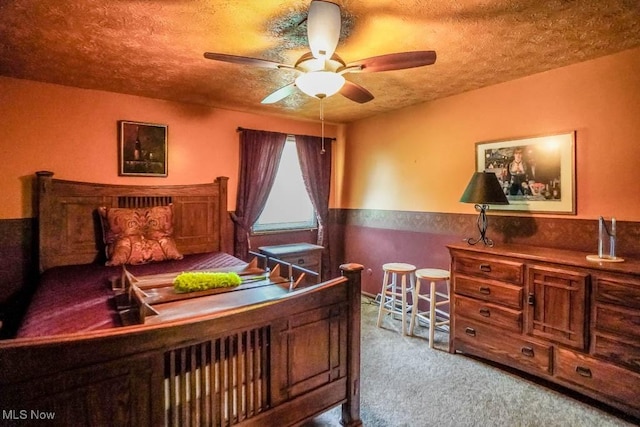 525 Marquardt Ave NE, North Canton, OH 44720 - carpeted bedroom with wainscoting and a textured ceiling