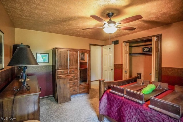 525 Marquardt Ave NE, North Canton, OH 44720 - carpeted bedroom with a textured ceiling and ceiling fan