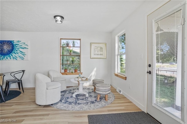 935 Portage Lakes Dr, Coventry Township, OH 44319 - sitting room with wood finished floors