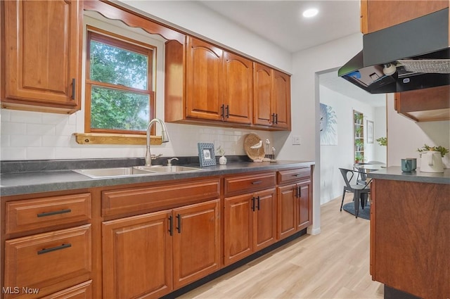 935 Portage Lakes Dr, Coventry Township, OH 44319 - kitchen with exhaust hood, dark countertops, plenty of natural light, and recessed lighting