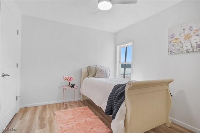 935 Portage Lakes Dr, Coventry Township, OH 44319 - bedroom featuring wood finished floors and a ceiling fan