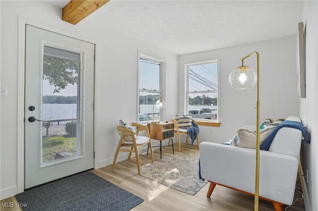 935 Portage Lakes Dr, Coventry Township, OH 44319 - living room featuring wood finished floors and a water view