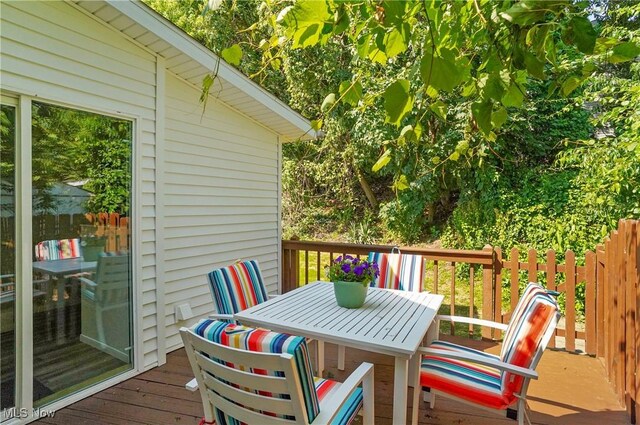 935 Portage Lakes Dr, Coventry Township, OH 44319 - wooden deck featuring outdoor dining space