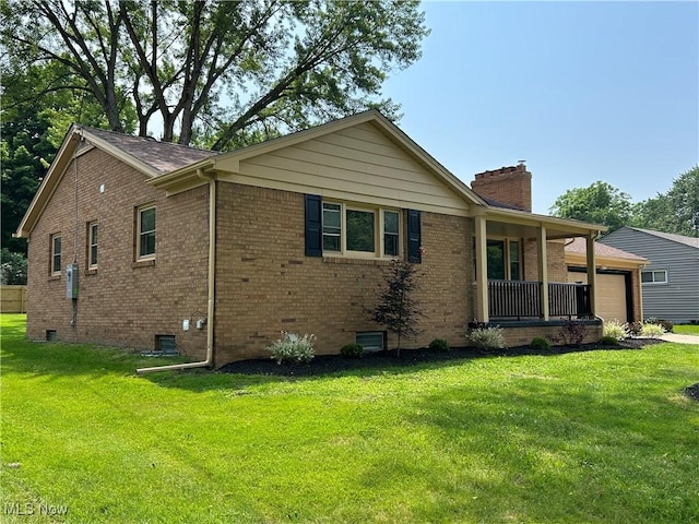 7295 Clovermeade Ave, Poland, OH 44514 - view of front facade featuring a chimney, a front lawn, crawl space, and brick siding
