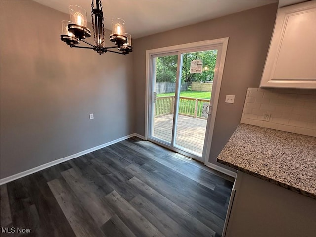 7295 Clovermeade Ave, Poland, OH 44514 - unfurnished dining area with a chandelier and dark wood-style flooring