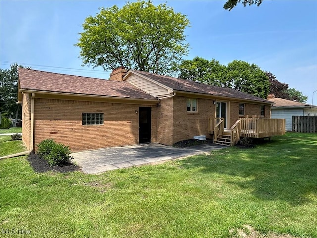 7295 Clovermeade Ave, Poland, OH 44514 - back of house with brick siding, a lawn, a chimney, a deck, and a patio area