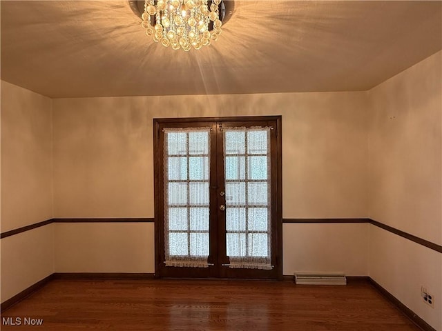 3022 Heatherbrae Dr, Poland, OH 44514 - spare room with wood finished floors, french doors, and a chandelier