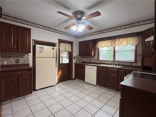 3022 Heatherbrae Dr, Poland, OH 44514 - kitchen with white appliances, dark countertops, tasteful backsplash, ceiling fan, and light tile patterned flooring