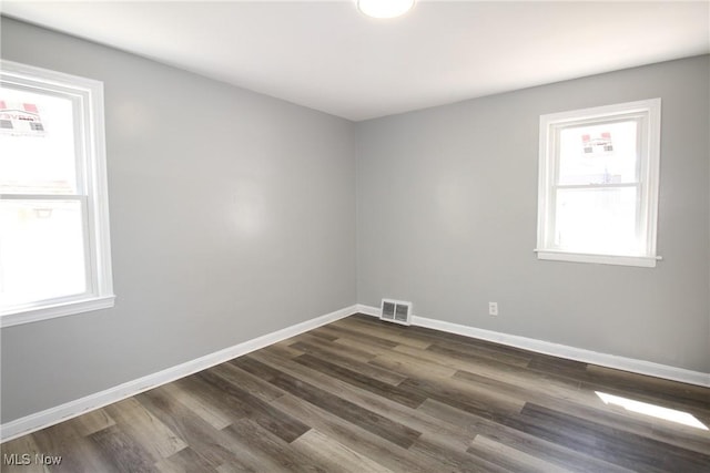 230 E 242nd St, Euclid, OH 44123 - empty room with dark wood-type flooring and baseboards