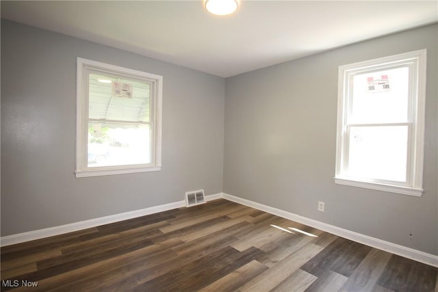 230 E 242nd St, Euclid, OH 44123 - empty room featuring plenty of natural light and dark wood-style floors
